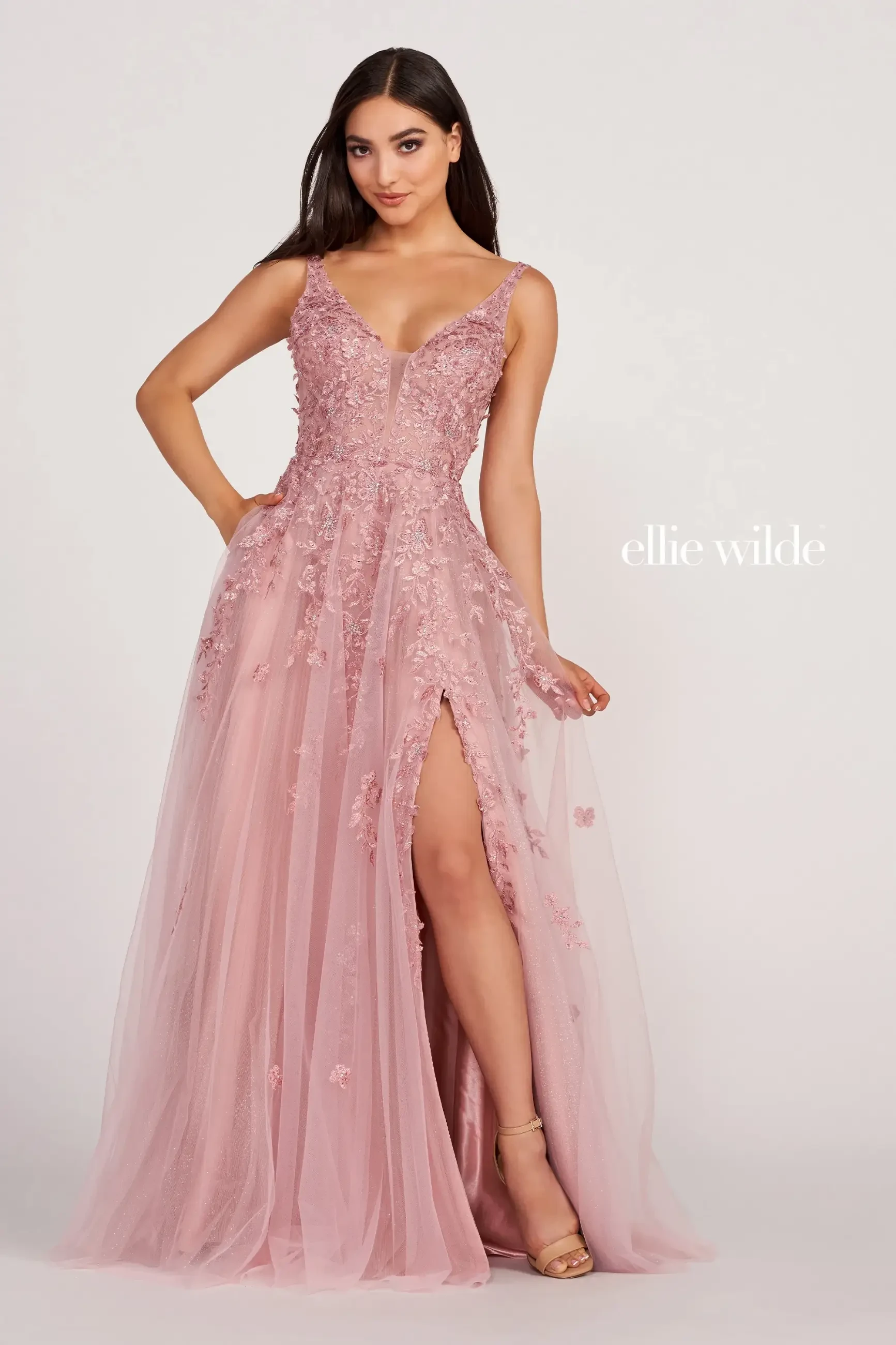 model is wearing a rose quartz sleeveless a-line prom dress